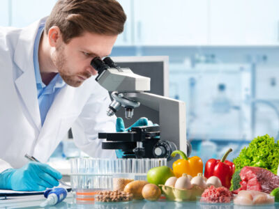 Food quality control expert inspecting specimens of groceries in the laboratory